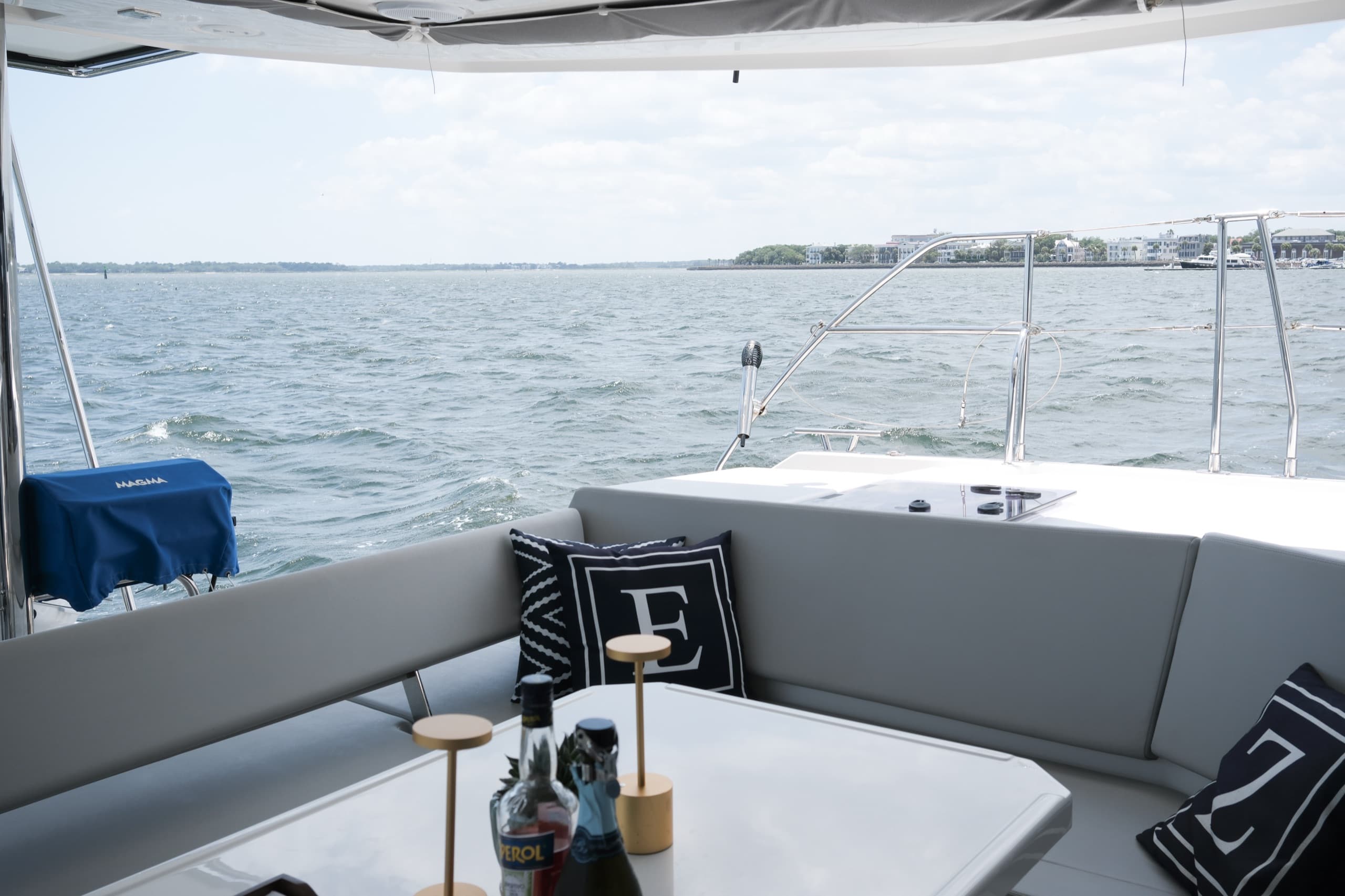 Everything Zen's outdoor dining table in the foreground facing the stern with the Charleston Battery in the background. 