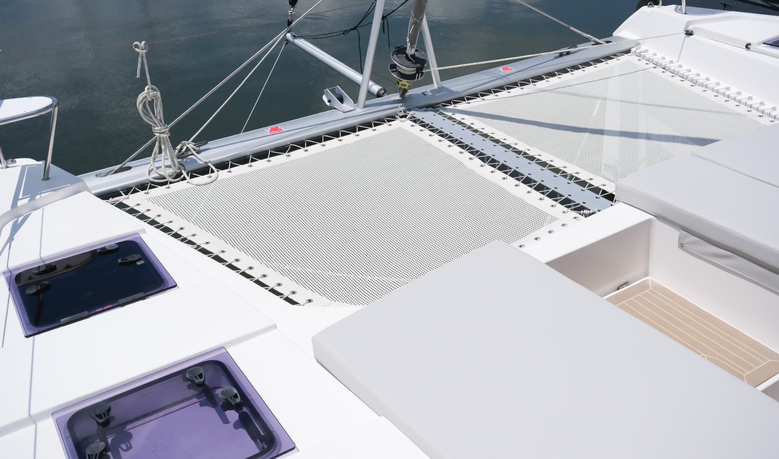 Bow of Everything Zen, featuring a large trampoline suspended between wide hulls. 