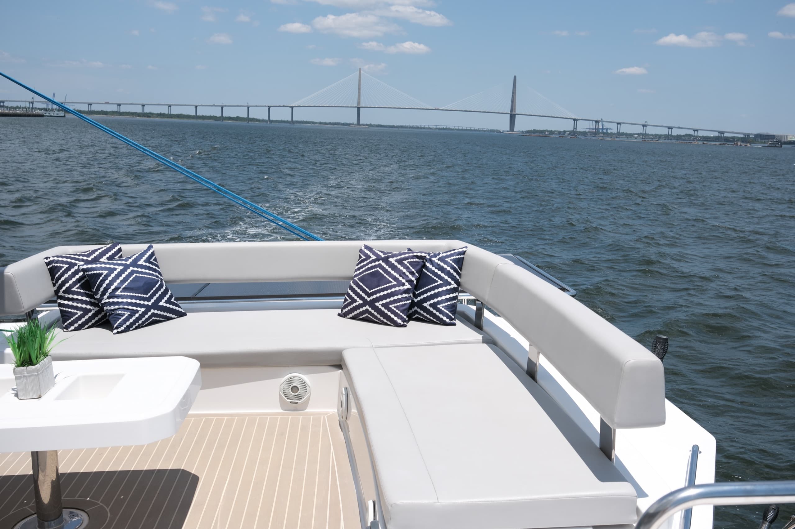 Upper deck of Everything Zen with amble seating and a table. The bridge can be seen in the background. 